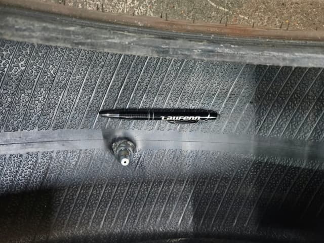 Large cut visible on the inside of a damaged tyre sidewall
