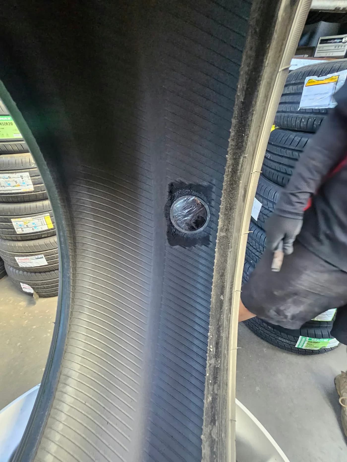 Plug-patch repair fitted to the inside of a tyre