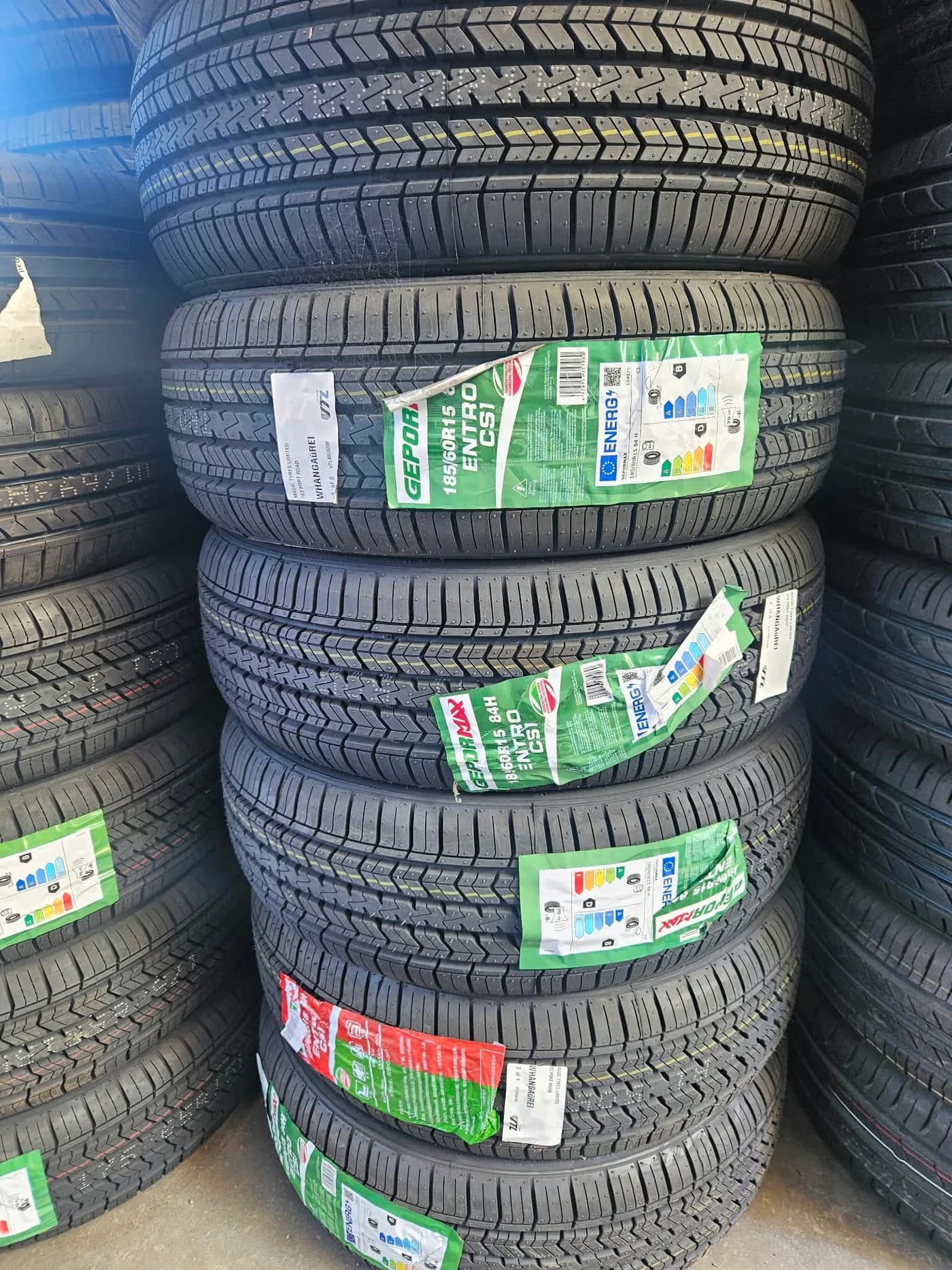 Stacks of brand-new tyres with product labels